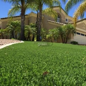 installer using a stake to secure turf
