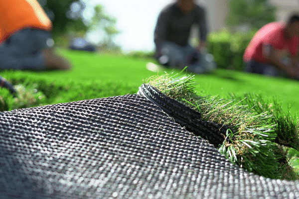 Artificial Grass Roll. Installation in progress. 